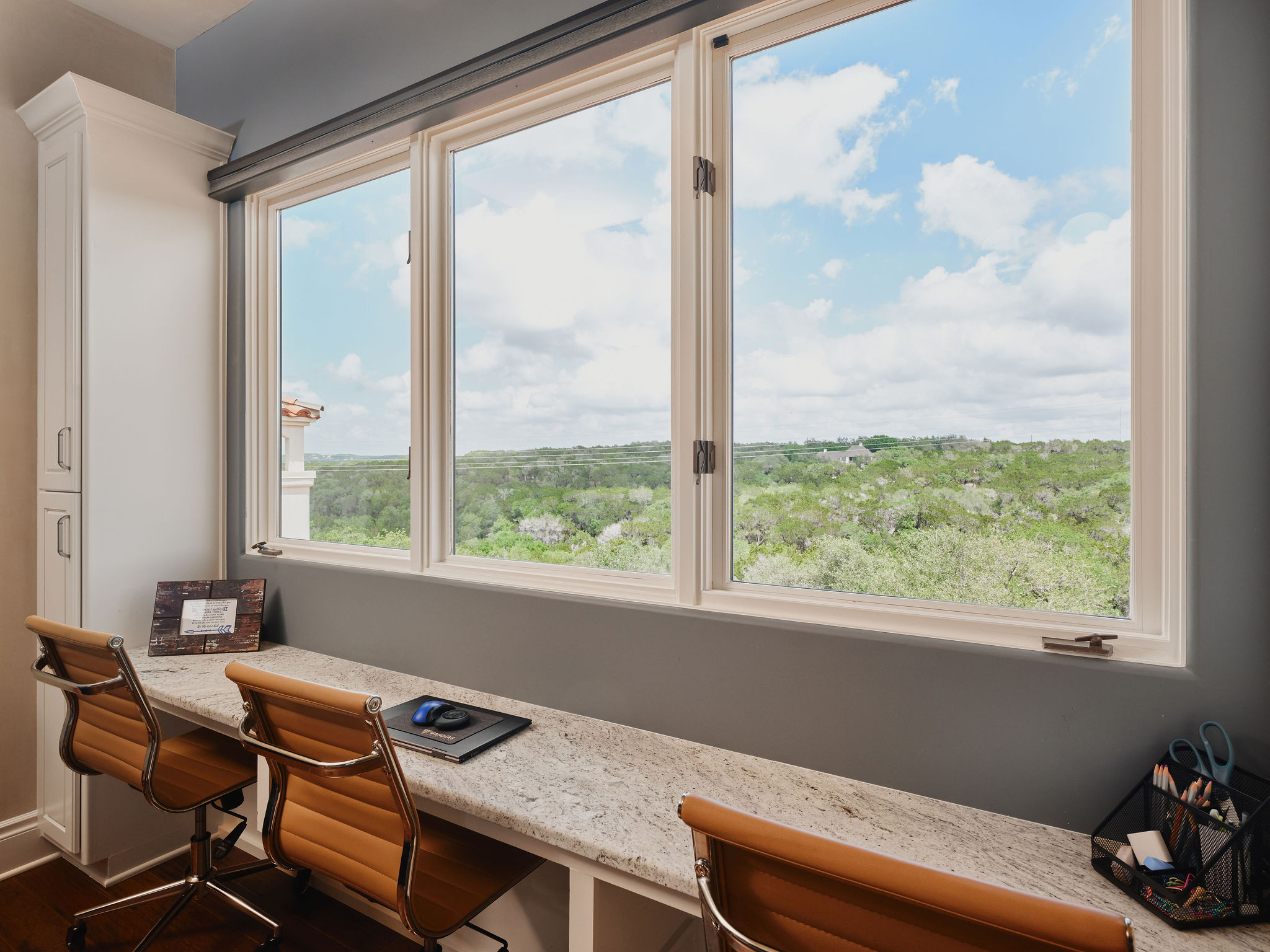 433 Brandon Way Austin, TX 78733 - Photo 30 of 40 An airy office space with ample built-in storage and inspiring views of the tree-dotted hillsides.