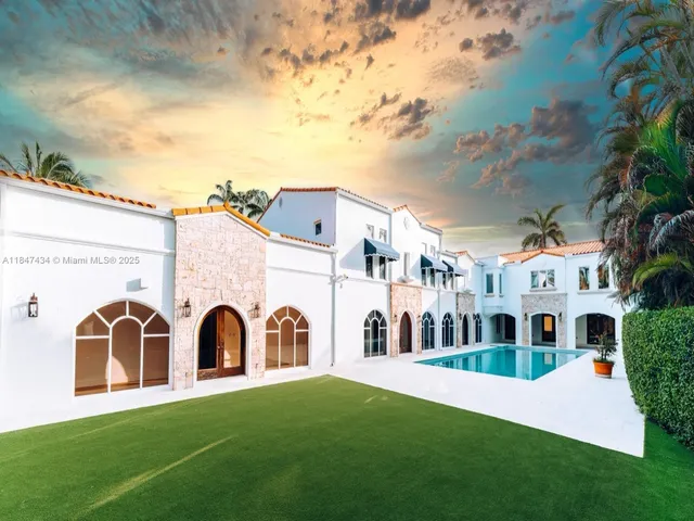 a view of multiple house with a yard