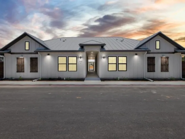 front view of a house with a street