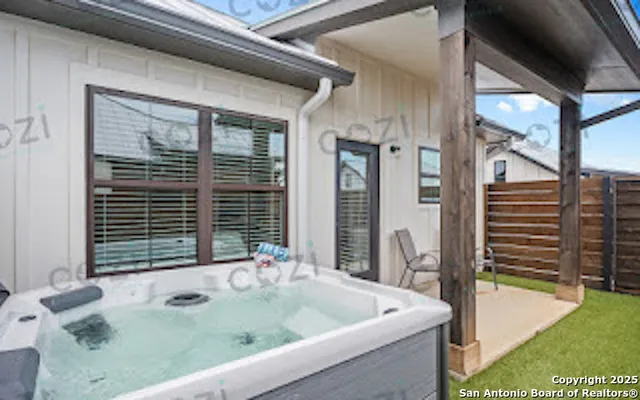 a bathroom with a tub and a sink