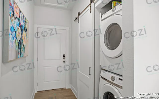 a view of a hallway with washer and dryer