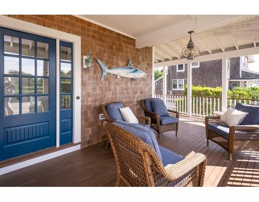 16 Gannett Road Scituate, MA 02066 - Photo 12 of 42 a living room with furniture a chandelier and a floor to ceiling window