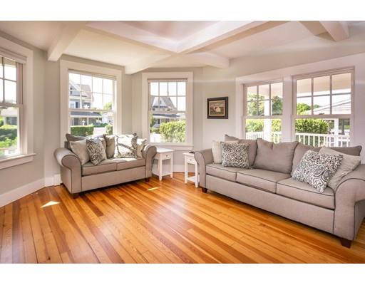 16 Gannett Road Scituate, MA 02066 - Photo 16 of 42 a living room with furniture and a large window