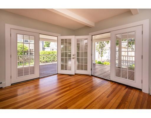 16 Gannett Road Scituate, MA 02066 - Photo 18 of 42 a view of an empty room with wooden floor and a window
