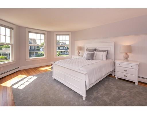 16 Gannett Road Scituate, MA 02066 - Photo 25 of 42 a bedroom with a bed and a large window
