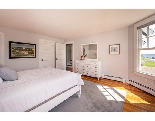 16 Gannett Road Scituate, MA 02066 - Photo 26 of 42 a bedroom with a bed and a window