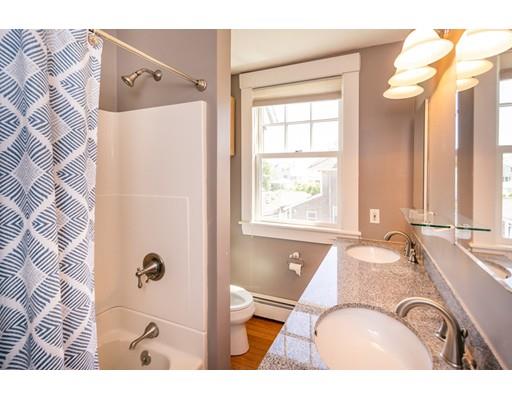 16 Gannett Road Scituate, MA 02066 - Photo 27 of 42 a bathroom with a bathtub and shower
