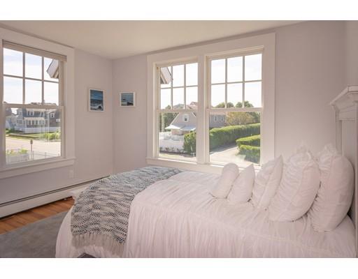 16 Gannett Road Scituate, MA 02066 - Photo 29 of 42 a bedroom with a bed and a large window