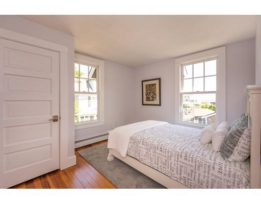 16 Gannett Road Scituate, MA 02066 - Photo 30 of 42 a bedroom with a bed and a window