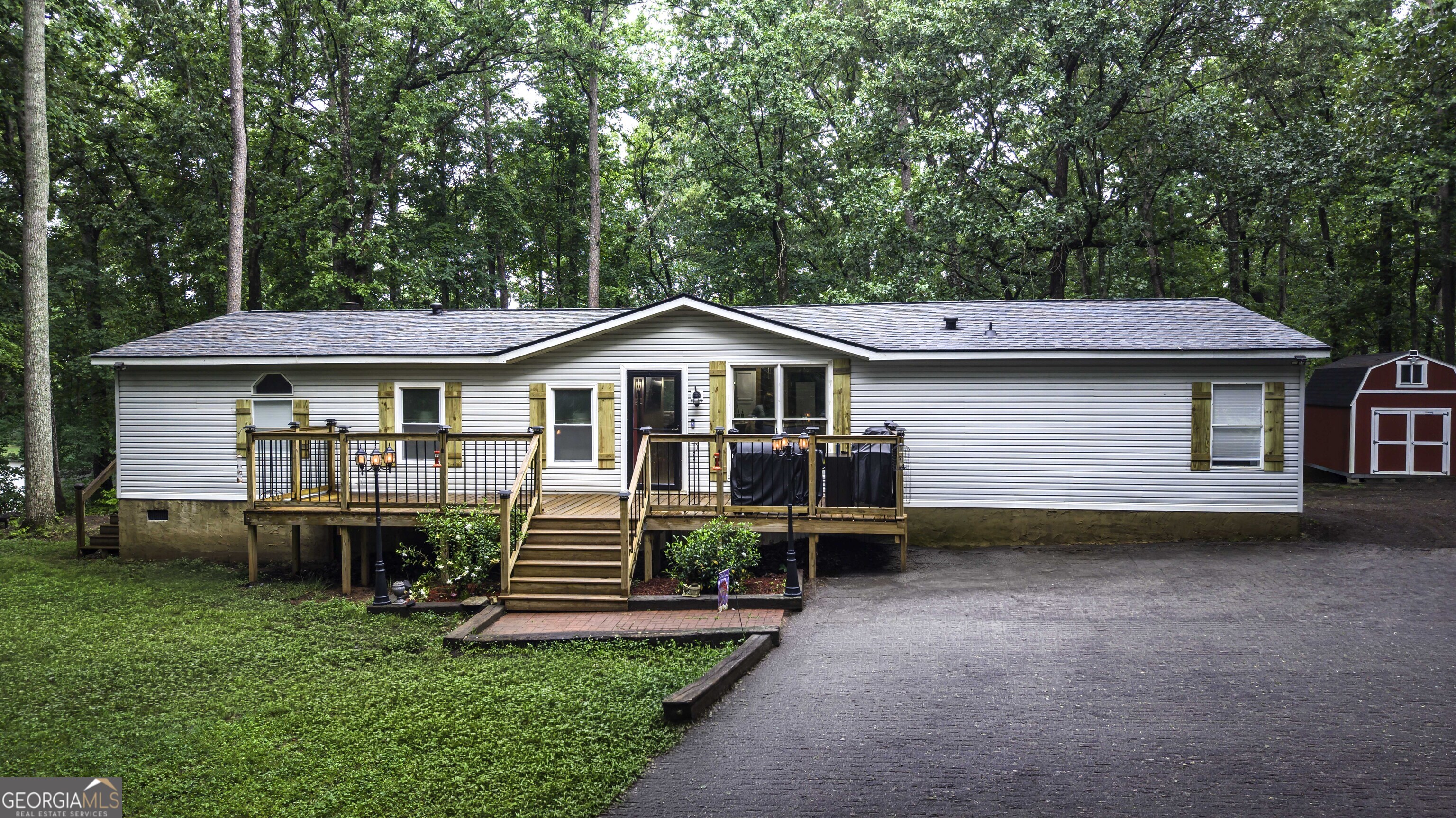91 Holder Road Temple, GA 30179 - Photo 2 of 40 a front view of a house with a yard and porch