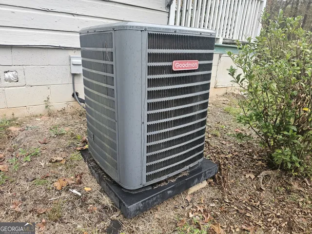 a view of a tree in the backyard