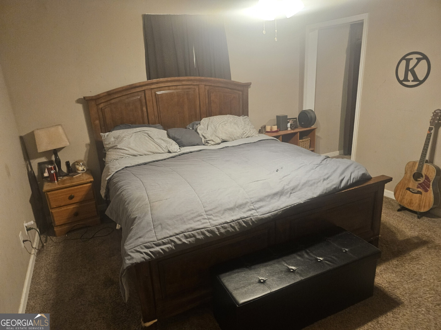 7131 Highway 27 Hamilton, GA 31811 - Photo 9 of 16 a bed sitting in a bedroom next to a window