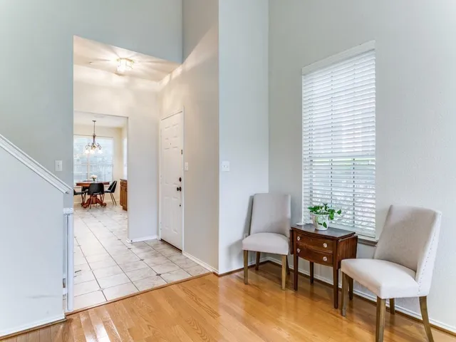 a view of a livingroom with furniture and a window