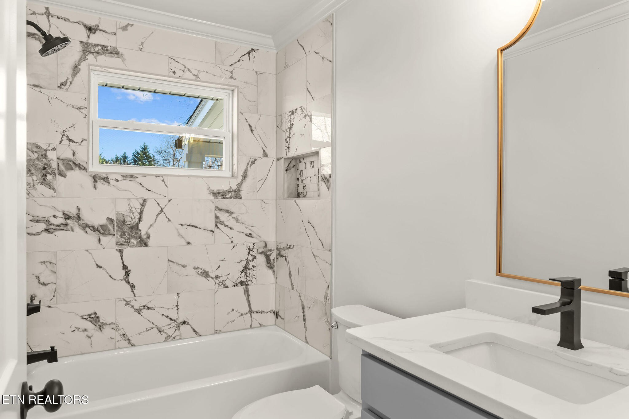 221 Medford Road Knoxville, TN 37922 - Photo 20 of 35 a bathroom with a sink a toilet and shower