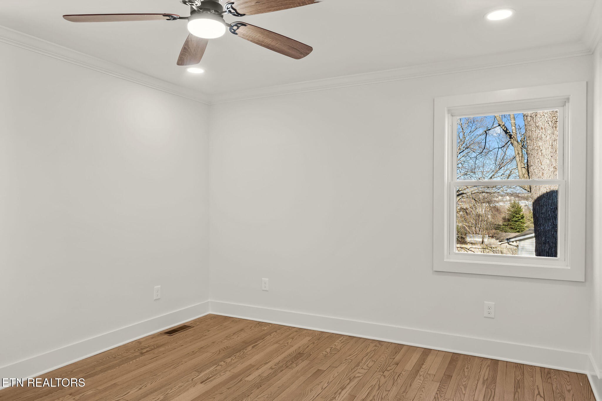 221 Medford Road Knoxville, TN 37922 - Photo 22 of 35 an empty room with a window and a fan