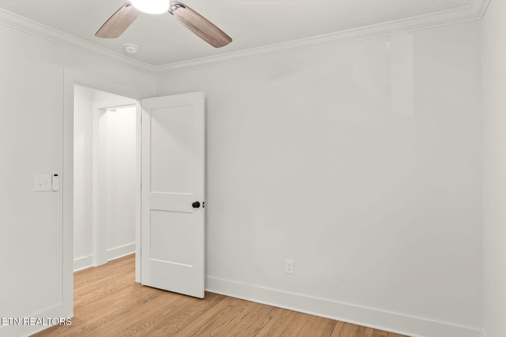 221 Medford Road Knoxville, TN 37922 - Photo 25 of 35 an empty room with wooden floor and fan