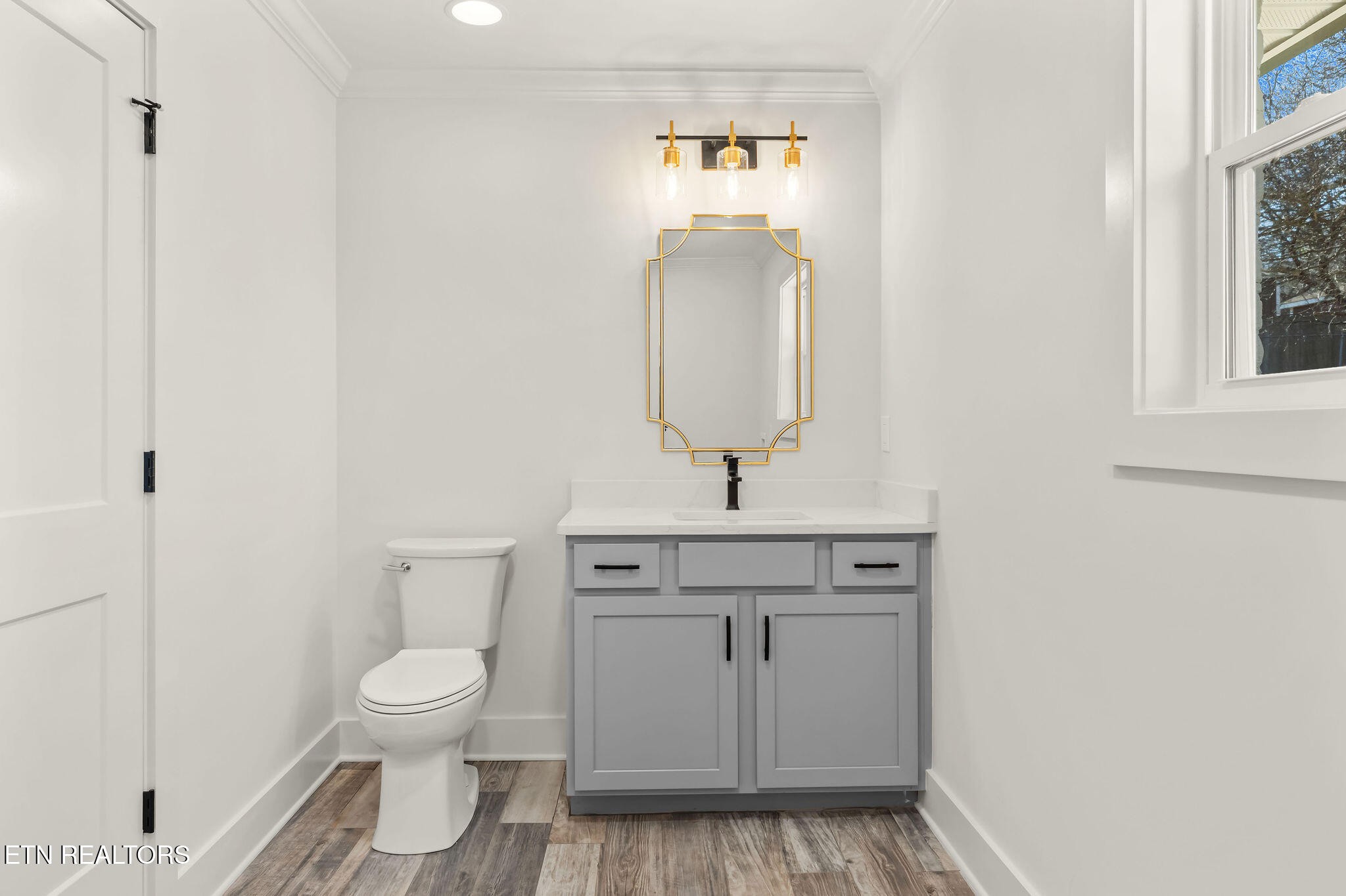221 Medford Road Knoxville, TN 37922 - Photo 26 of 35 a bathroom with a sink toilet and vanity