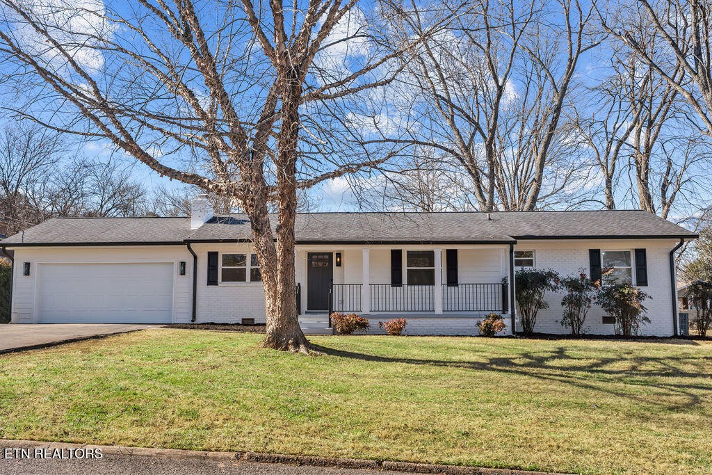 221 Medford Road Knoxville, TN 37922 - Photo 3 of 35 a front view of house with yard and trees in the background