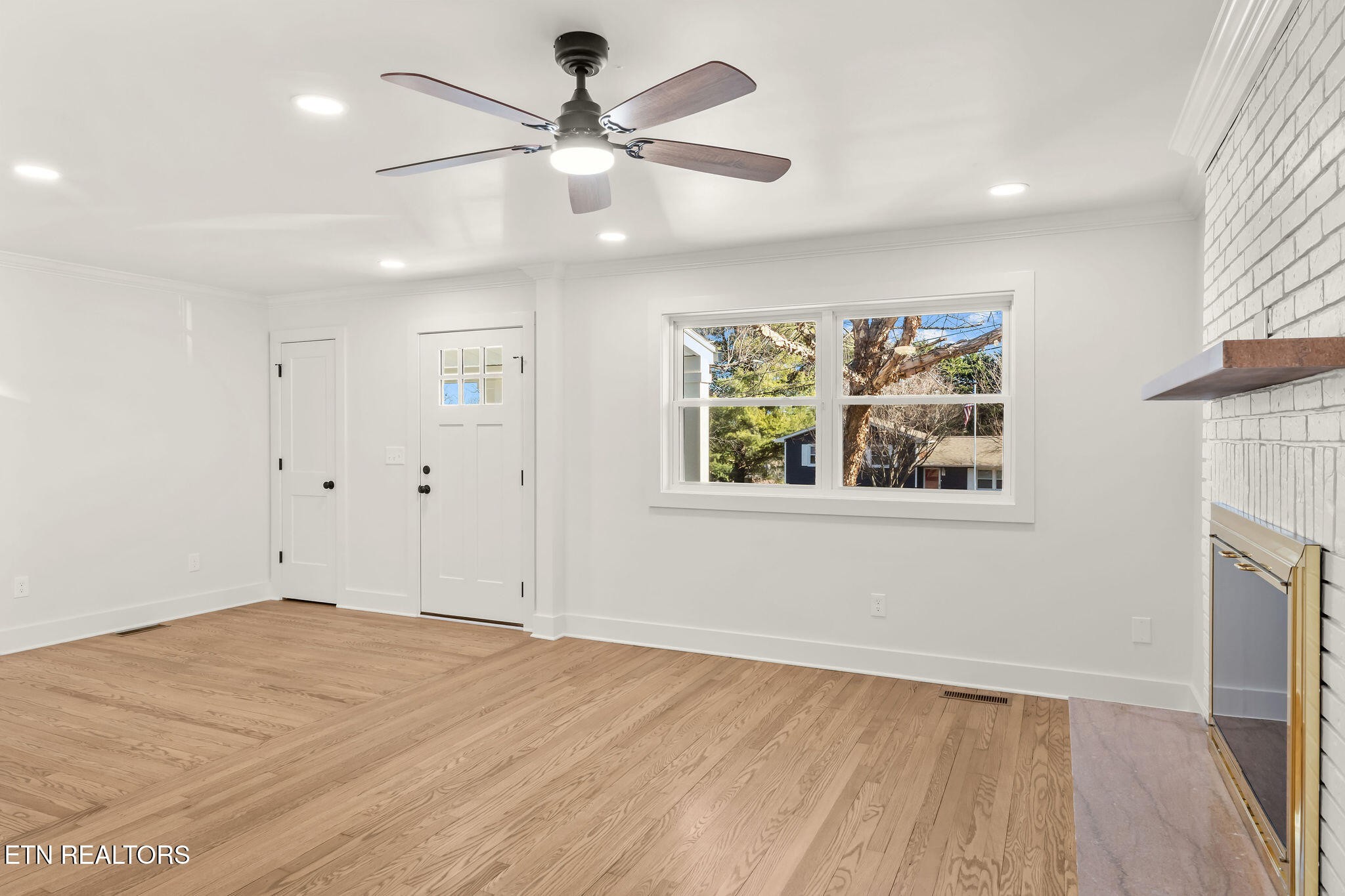 221 Medford Road Knoxville, TN 37922 - Photo 9 of 35 a view of empty room with wooden floor and fan