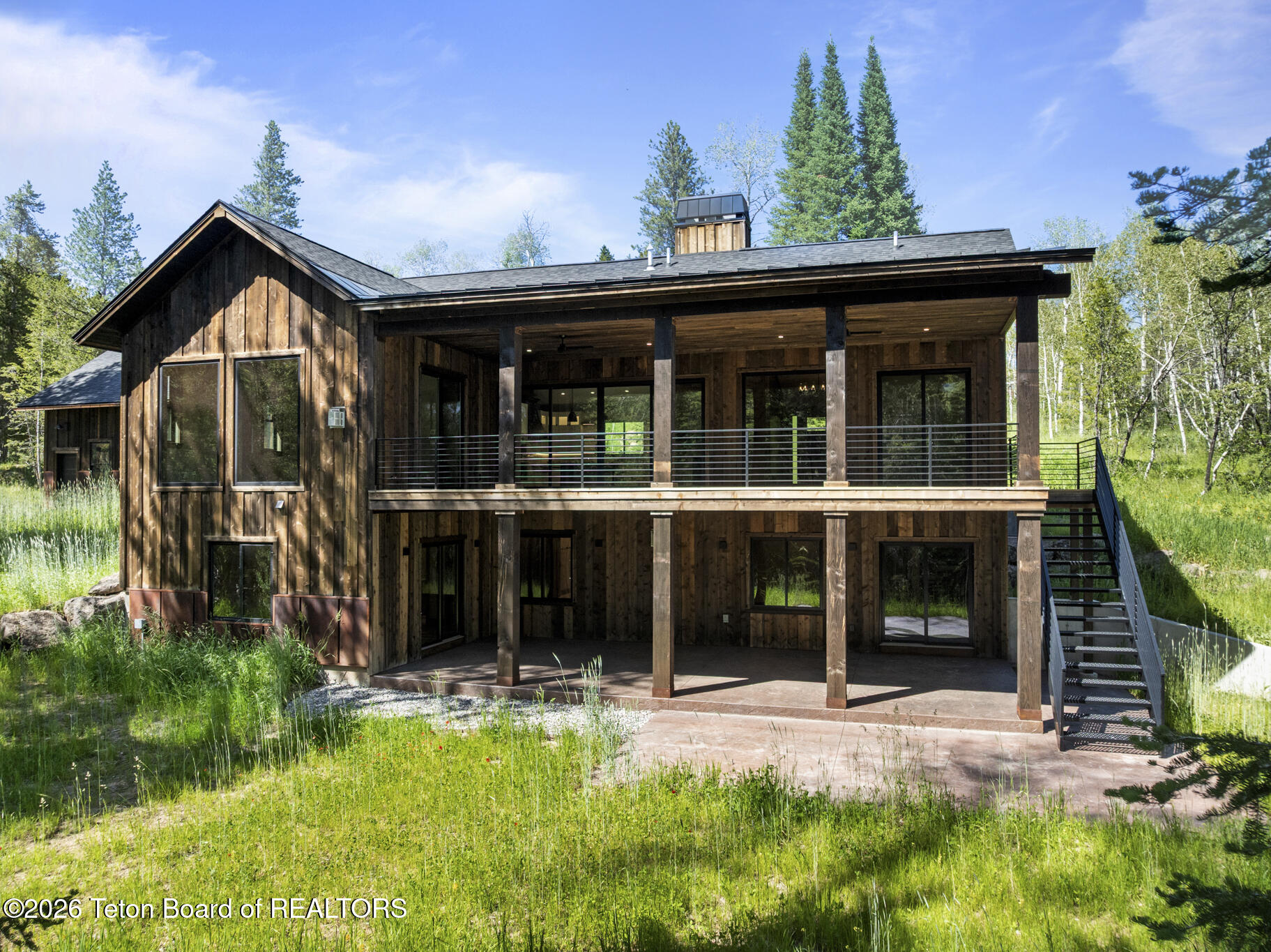 5727 Forest Ridge Road Victor, ID 83455 - Photo 3 of 80 Summer back of Home