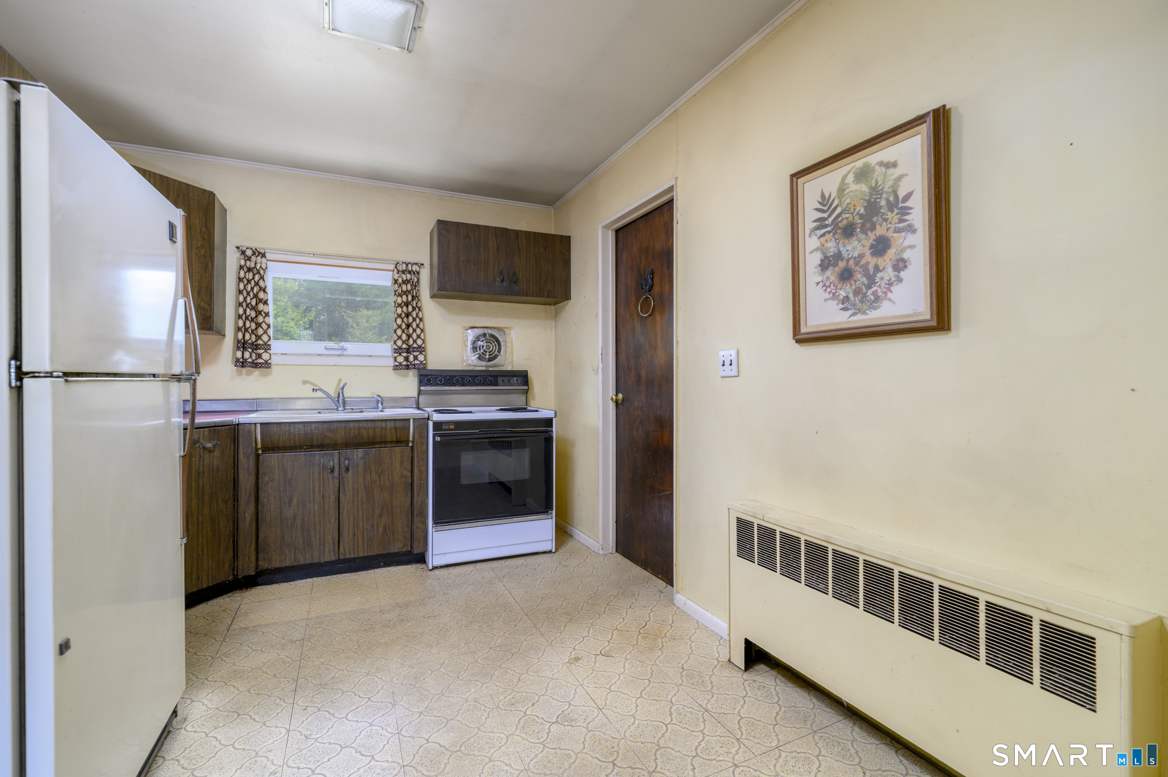 64 Alpine Street Stamford, CT 06905 - Photo 8 of 19 a kitchen with stainless steel appliances a refrigerator and a stove top oven