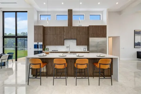 a dinning table and chairs in the kitchen