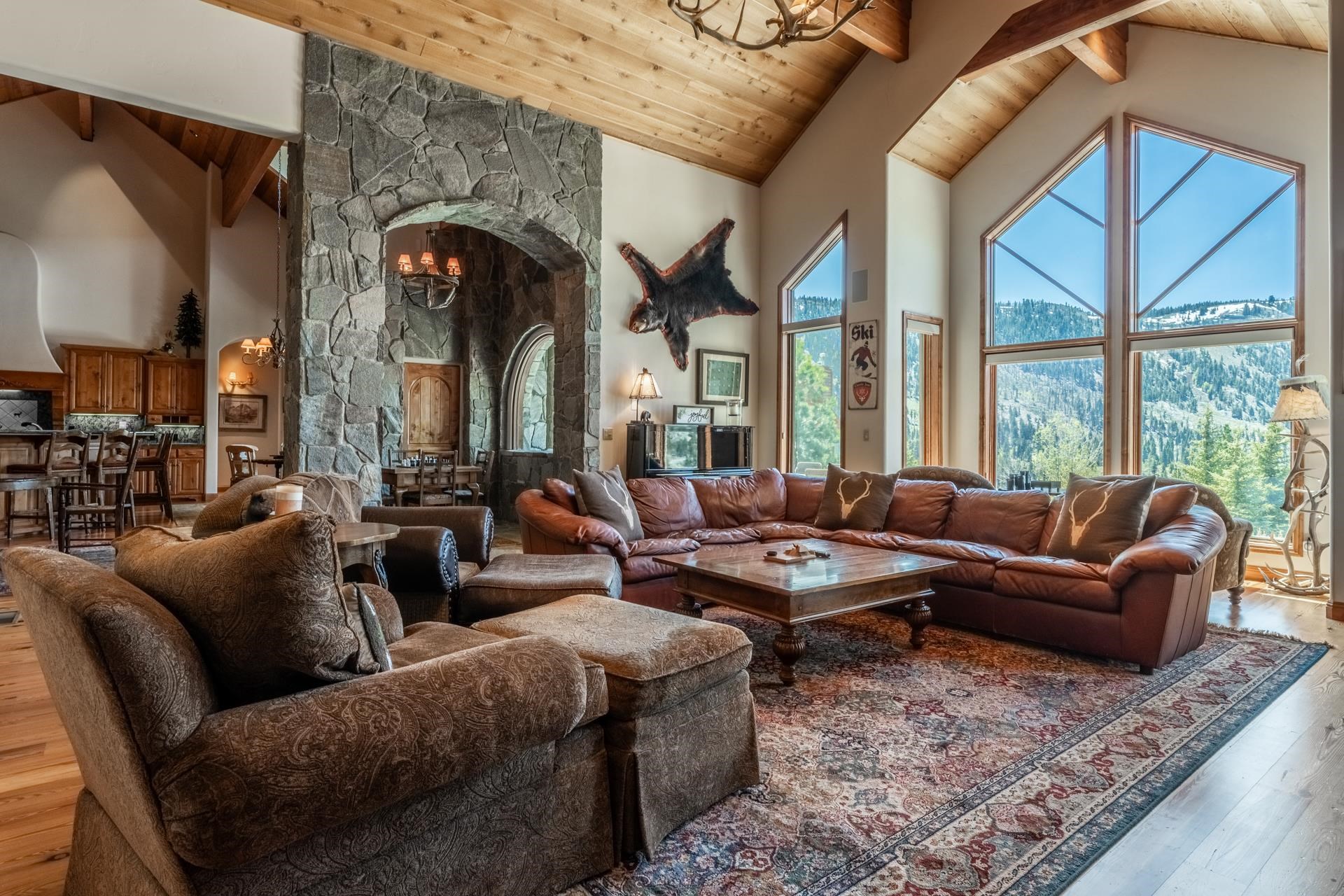 45 Skyline Road June Lake, CA 93529 - Photo 4 of 58 a living room with furniture fireplace and a large window