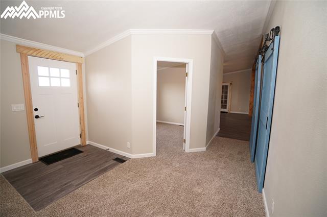 13745 Woodlake Road Elbert, CO 80106 - Photo 9 of 36 Entry, hallway and office entrance.