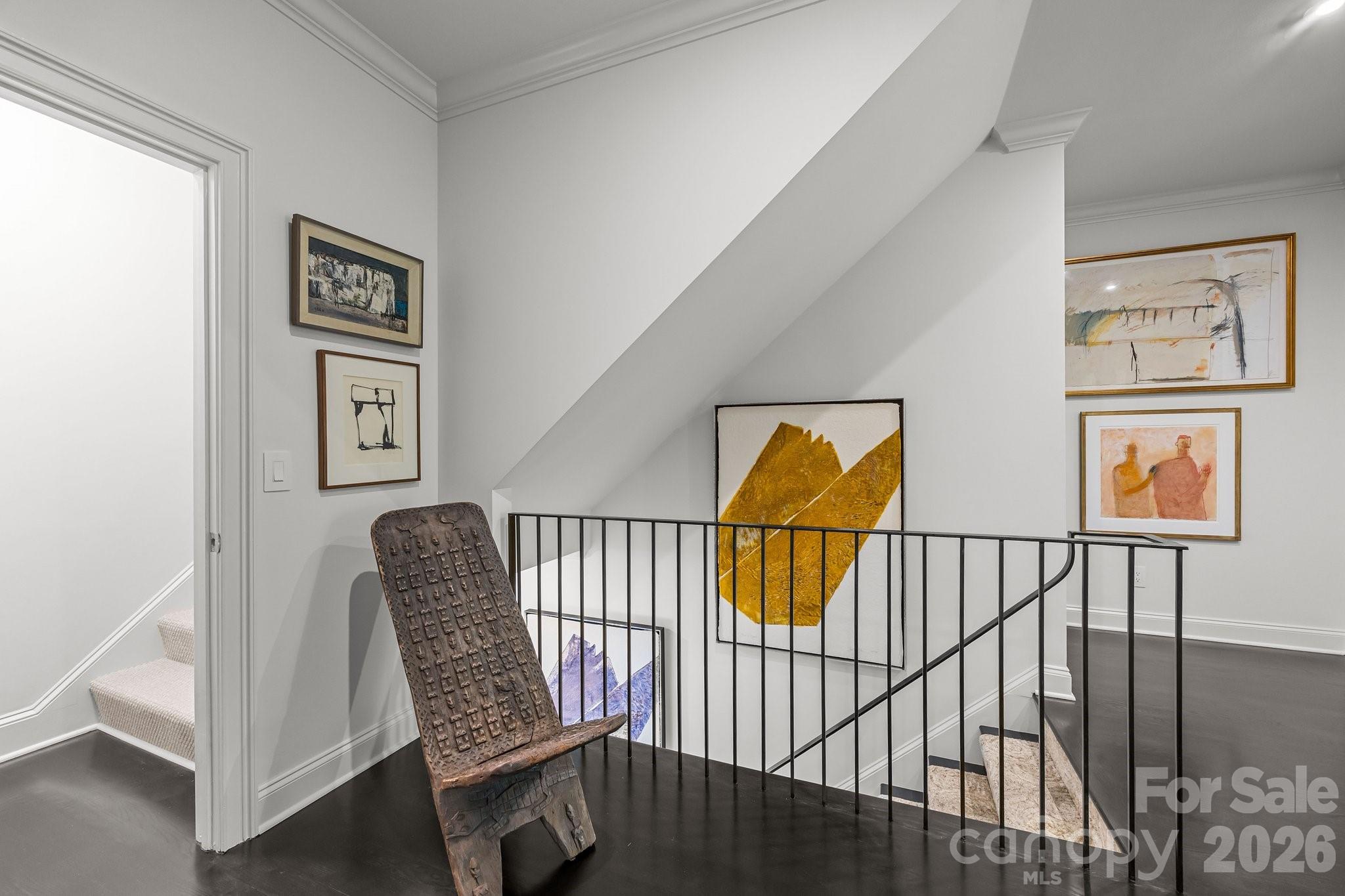 1550 High Street Charlotte, NC 28211 - Photo 17 of 34 a view of a hallway with paintings on the wall