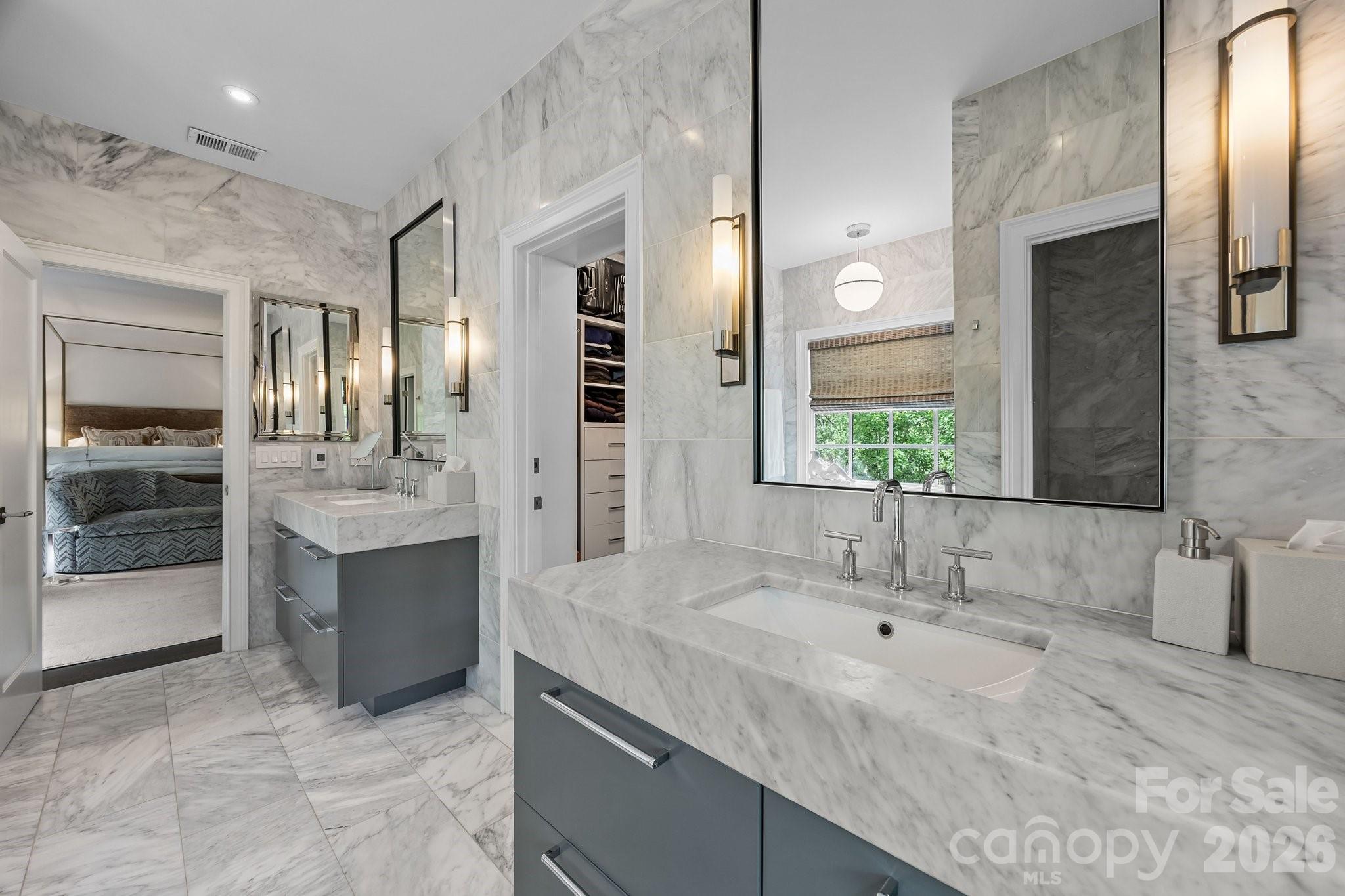 1550 High Street Charlotte, NC 28211 - Photo 22 of 34 a bathroom with a sink double vanity granite tub shower and a mirror