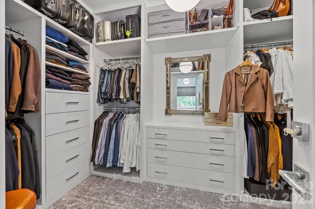 a bed room with a bed furniture and a window