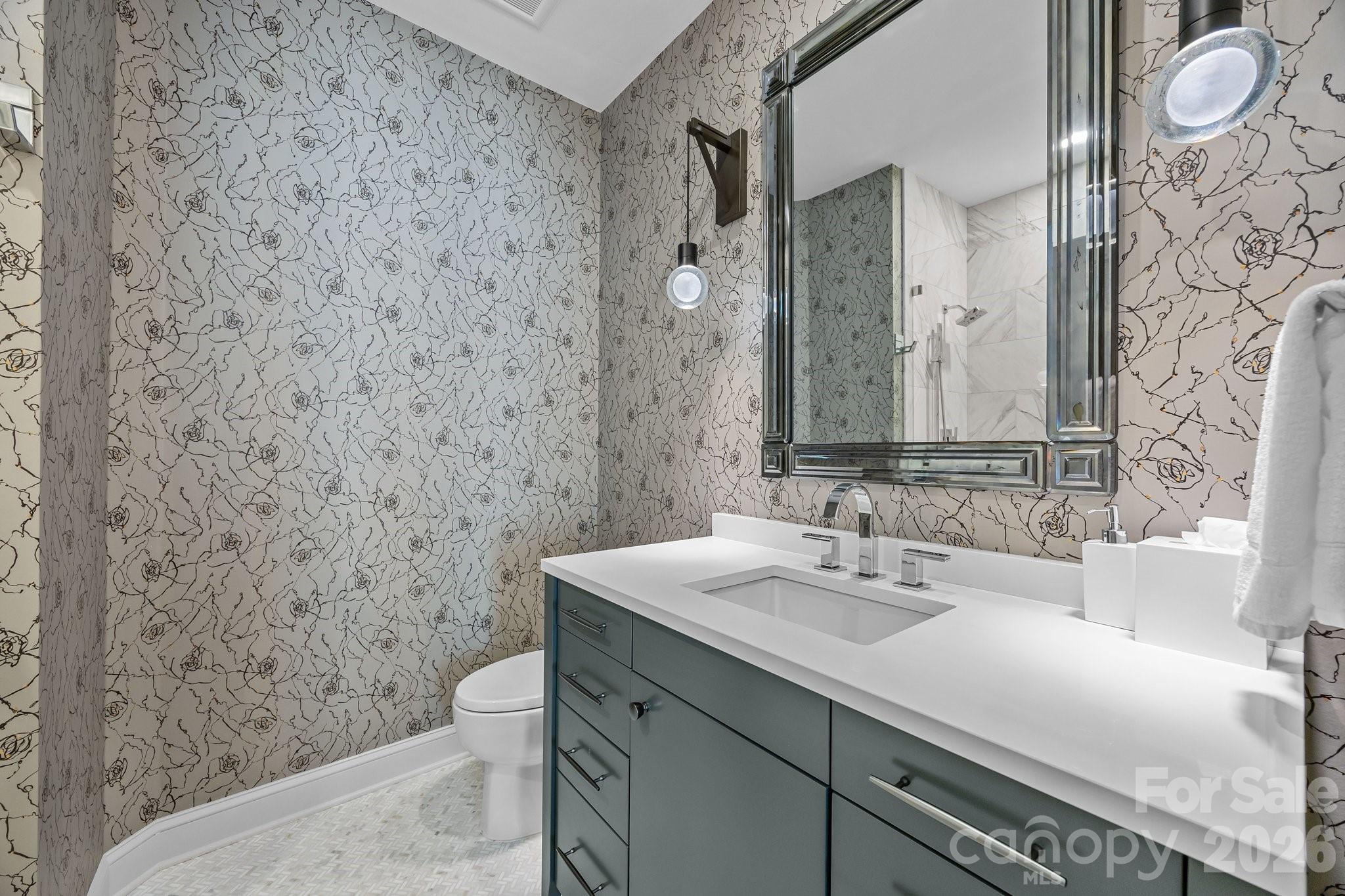 1550 High Street Charlotte, NC 28211 - Photo 25 of 34 a bathroom with a sink a toilet and mirror