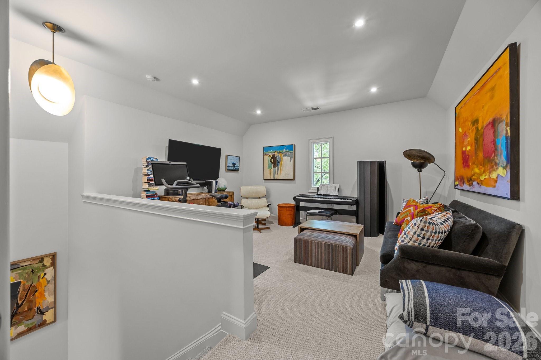 1550 High Street Charlotte, NC 28211 - Photo 29 of 34 a living room with furniture and a flat screen tv