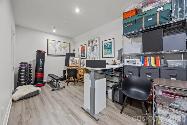 a view of a chairs and table in the backyard