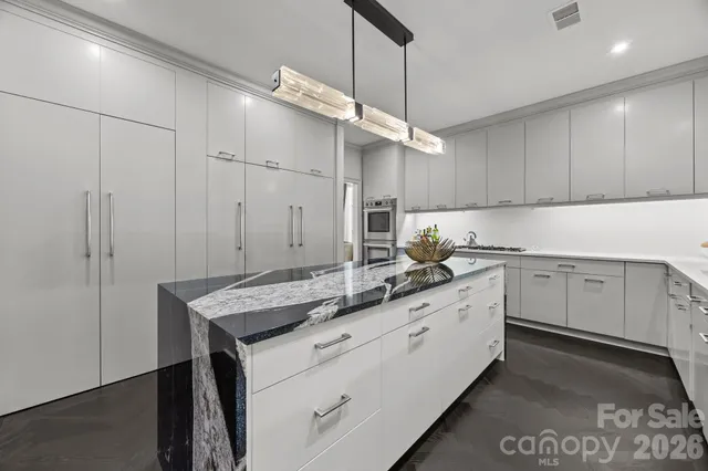 a kitchen with a sink cabinets and window