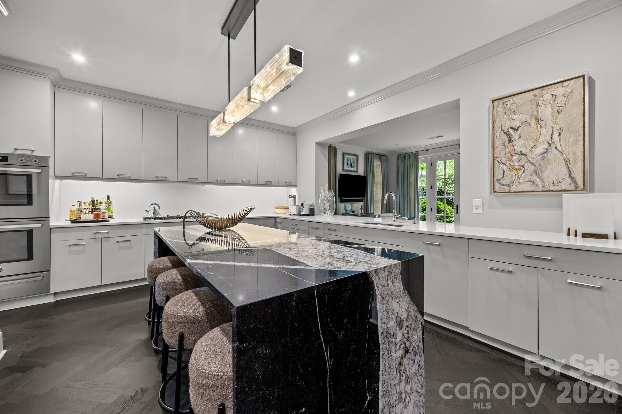 1550 High Street Charlotte, NC 28211 - Photo 9 of 34 a kitchen with a table chairs sink and cabinets