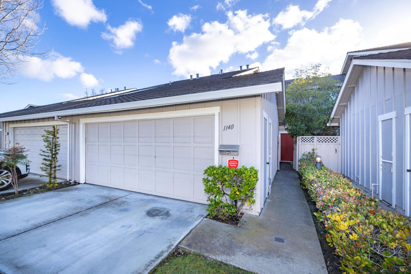1140 Nimitz Lane Foster City, CA 94404 - Photo 1 of 57 a front view of a house having yard