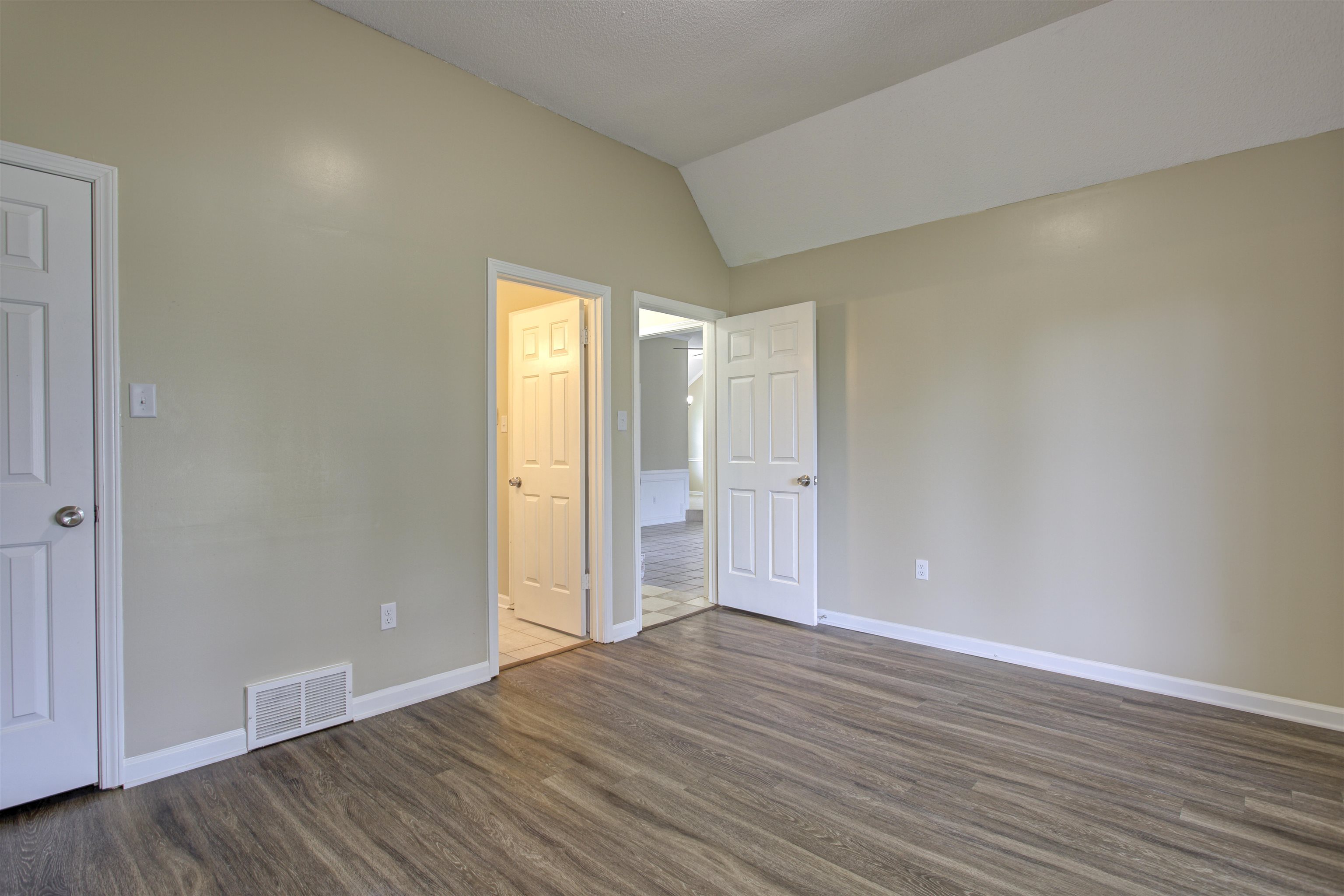 5259 Ross Road Memphis, TN 38141 - Photo 16 of 17 a view of an empty room with wooden floor and window