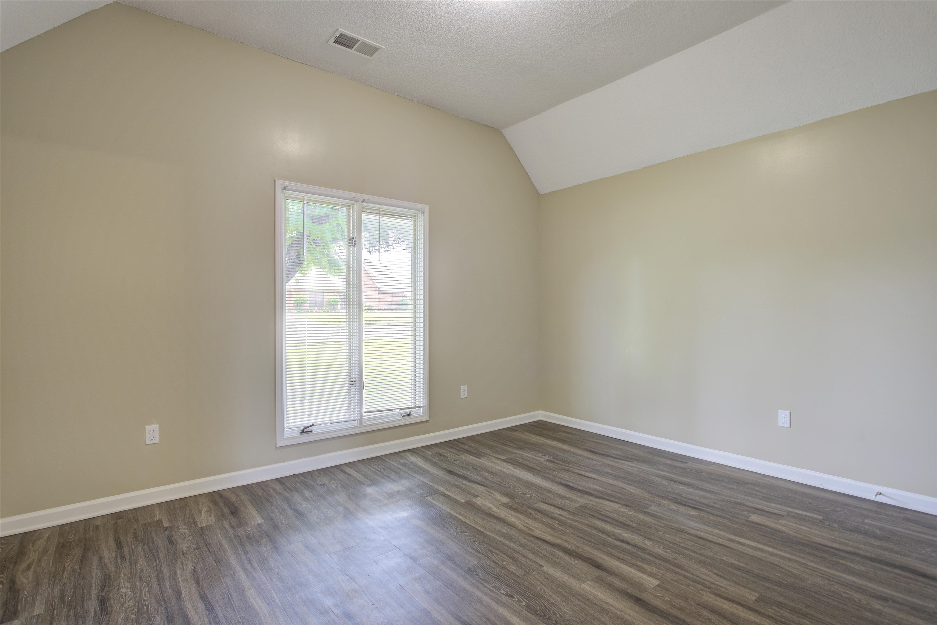 5259 Ross Road Memphis, TN 38141 - Photo 17 of 17 an empty room with wooden floor and window