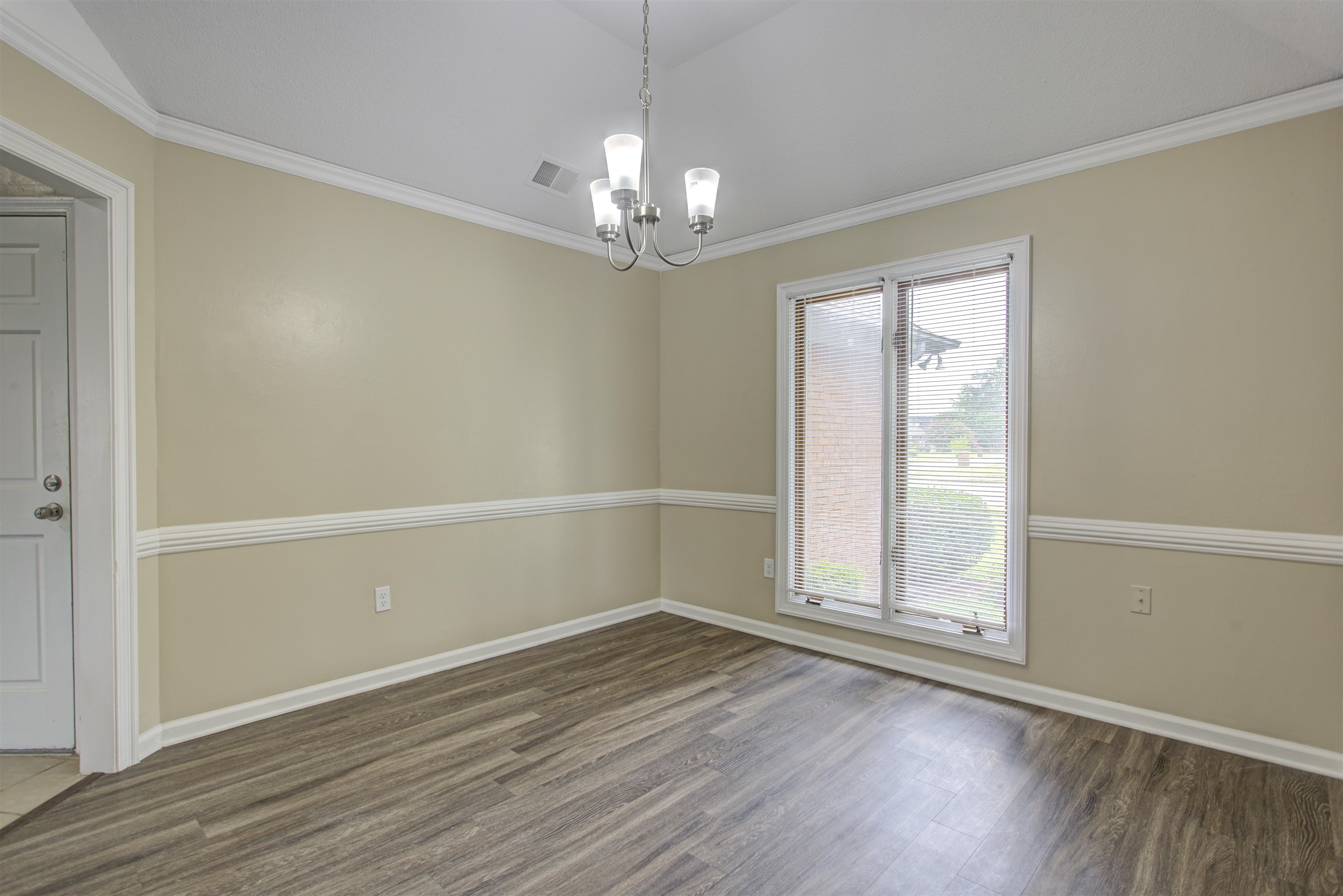 5259 Ross Road Memphis, TN 38141 - Photo 4 of 17 wooden floor in an empty room with a window