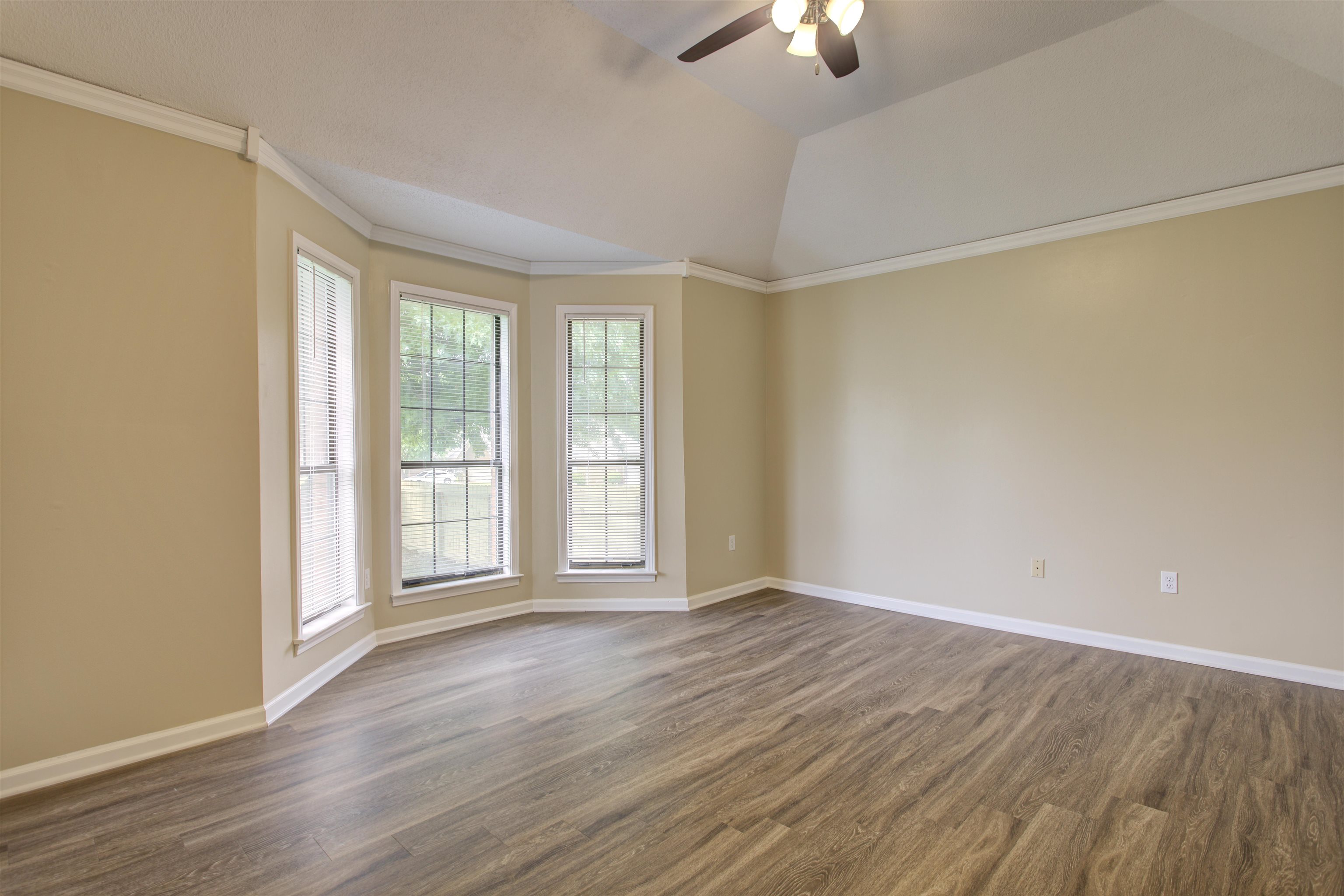 5259 Ross Road Memphis, TN 38141 - Photo 8 of 17 an empty room with wooden floor and windows