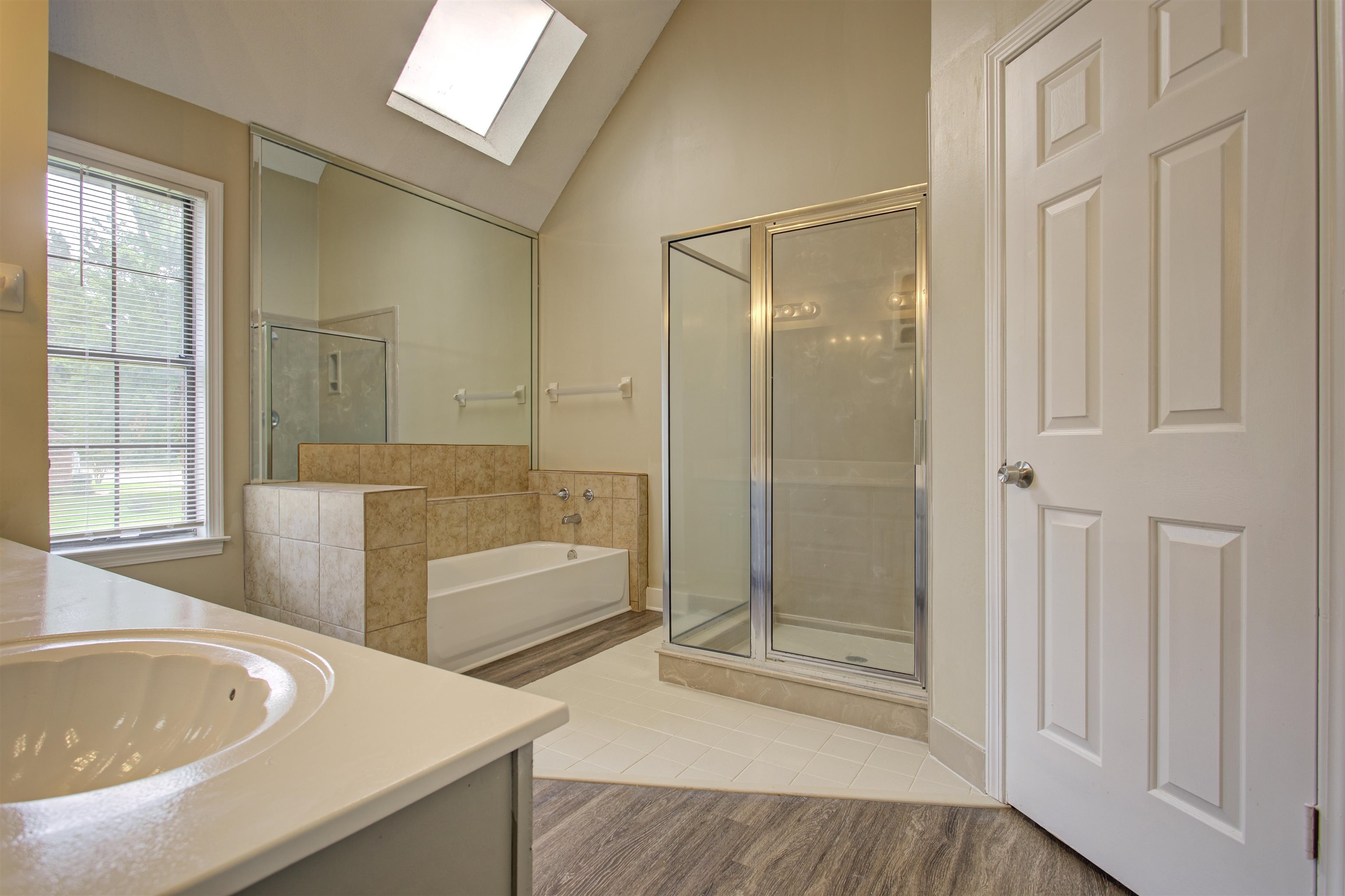 5259 Ross Road Memphis, TN 38141 - Photo 9 of 17 a spacious bathroom with a tub shower and sink