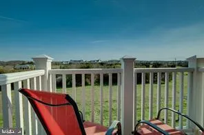 a view of a balcony with chairs