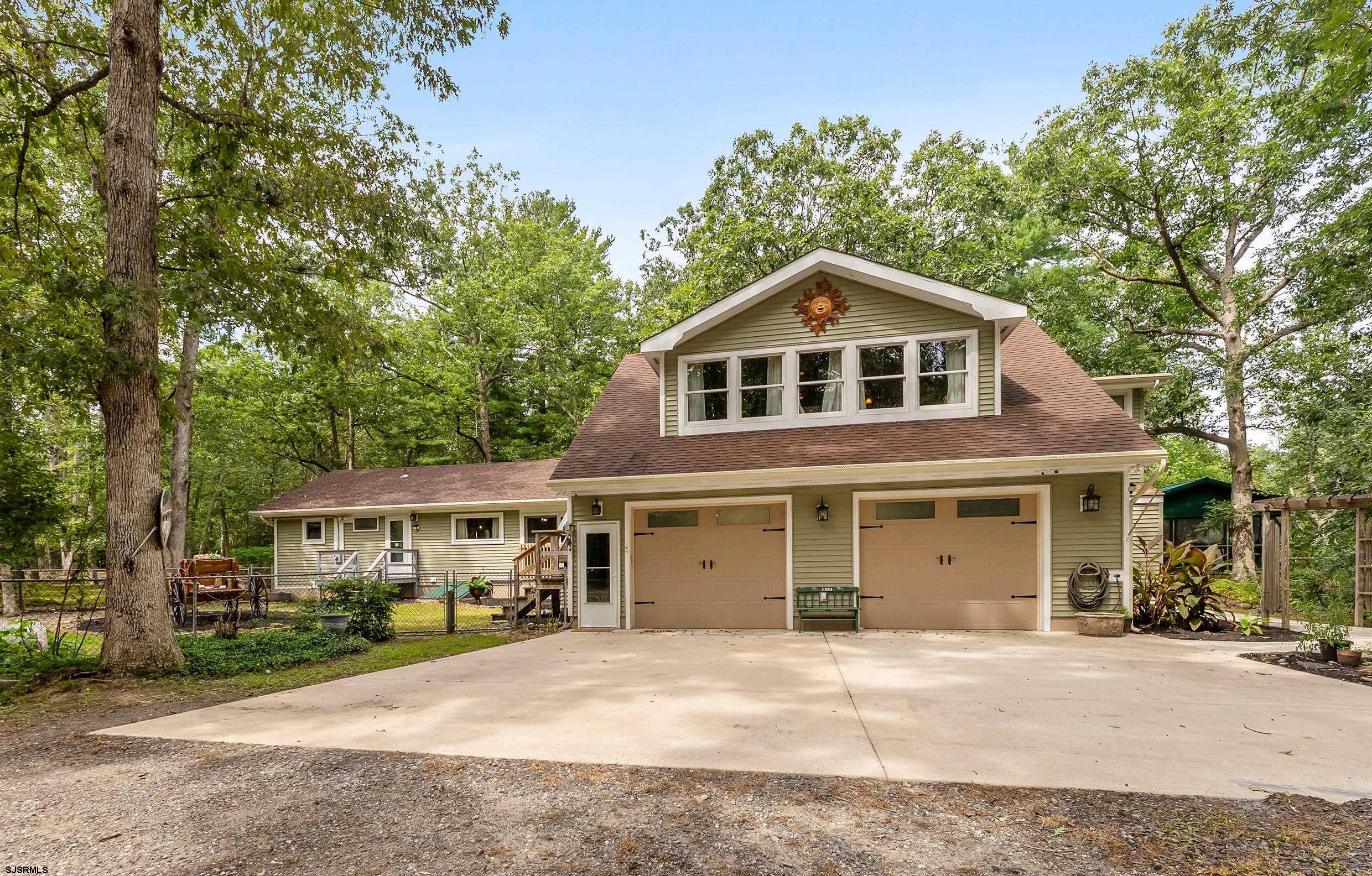 2015 High Bank Road Mays Landing, NJ 08330 - Photo 3 of 89 a front view of a house with a garden and trees