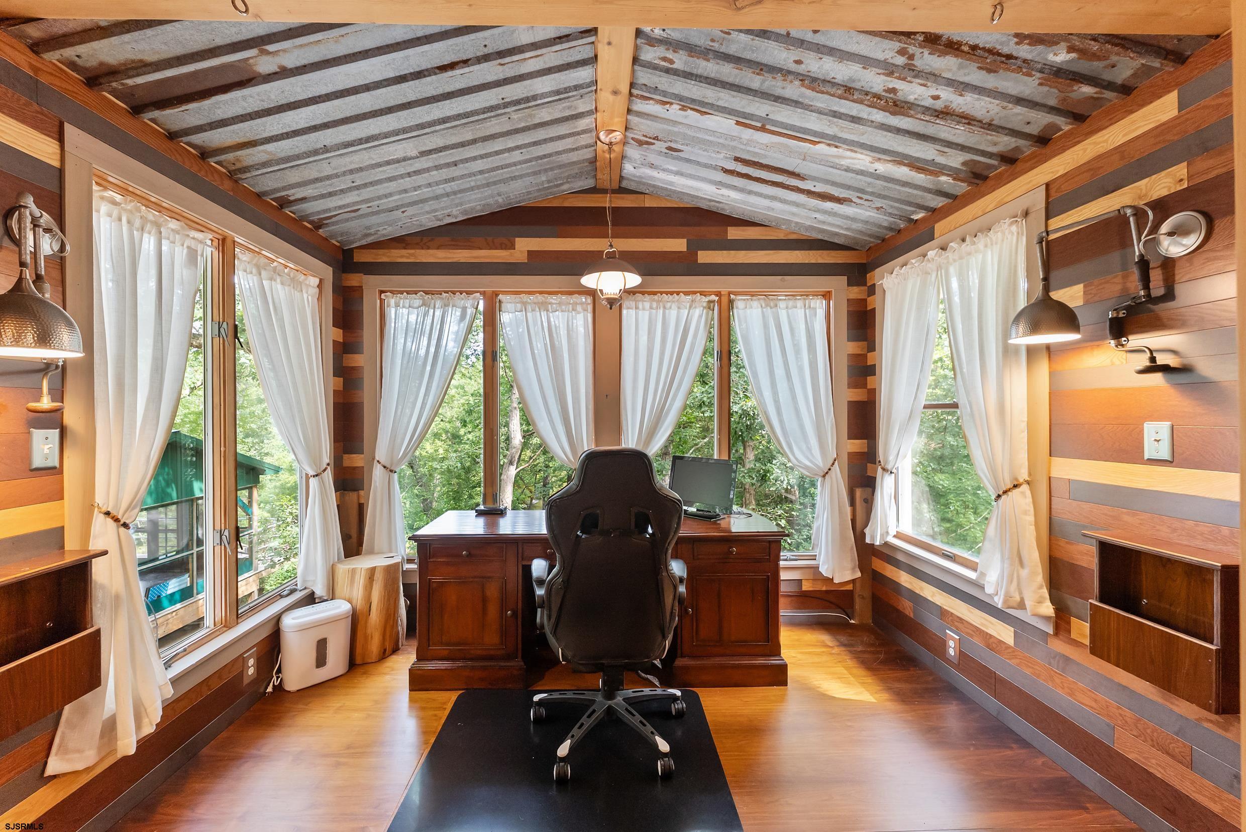 2015 High Bank Road Mays Landing, NJ 08330 - Photo 37 of 89 a living room with furniture floor to ceiling window hardwood floor and a flat screen tv