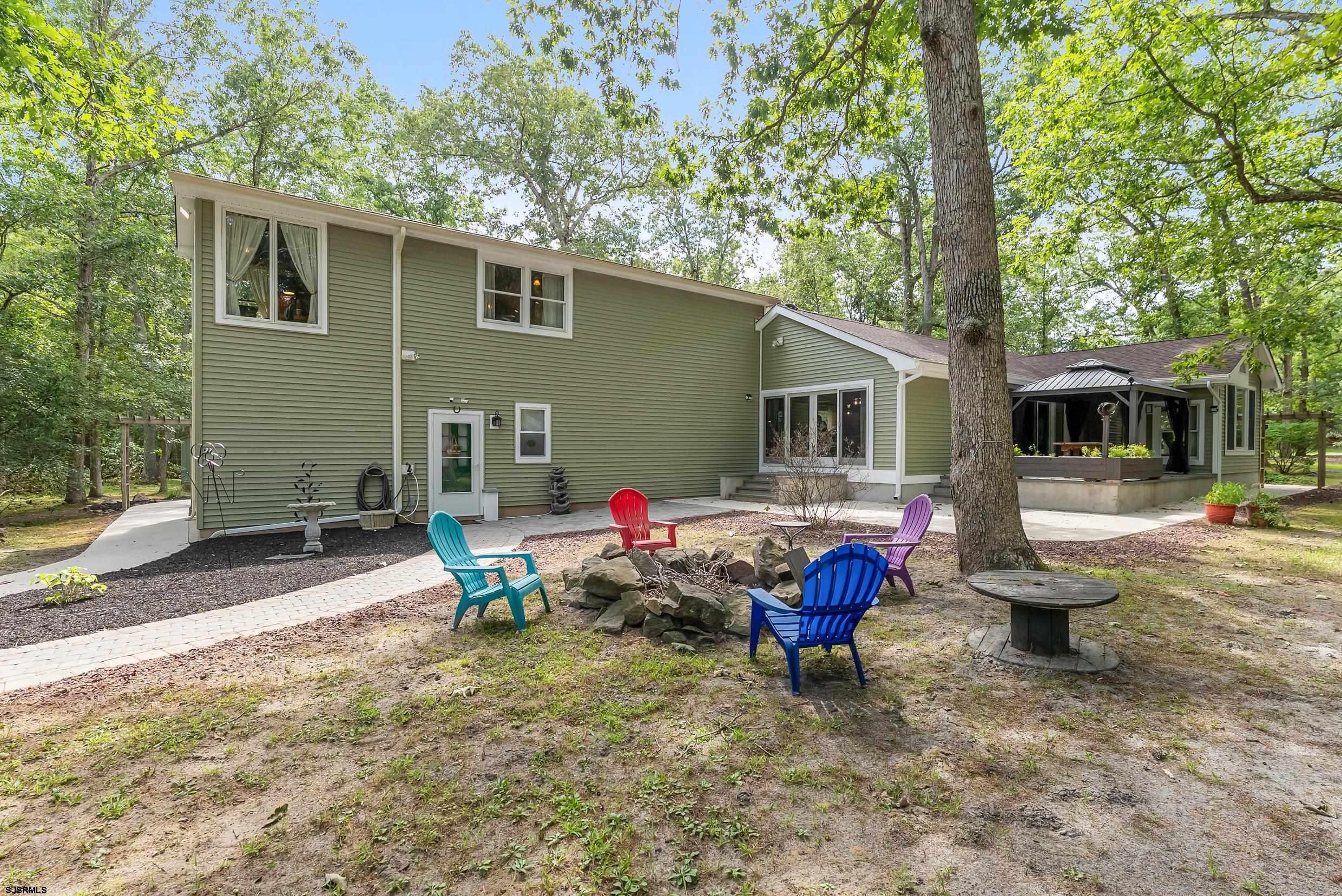 2015 High Bank Road Mays Landing, NJ 08330 - Photo 58 of 89 a backyard of a house with barbeque oven table and chairs