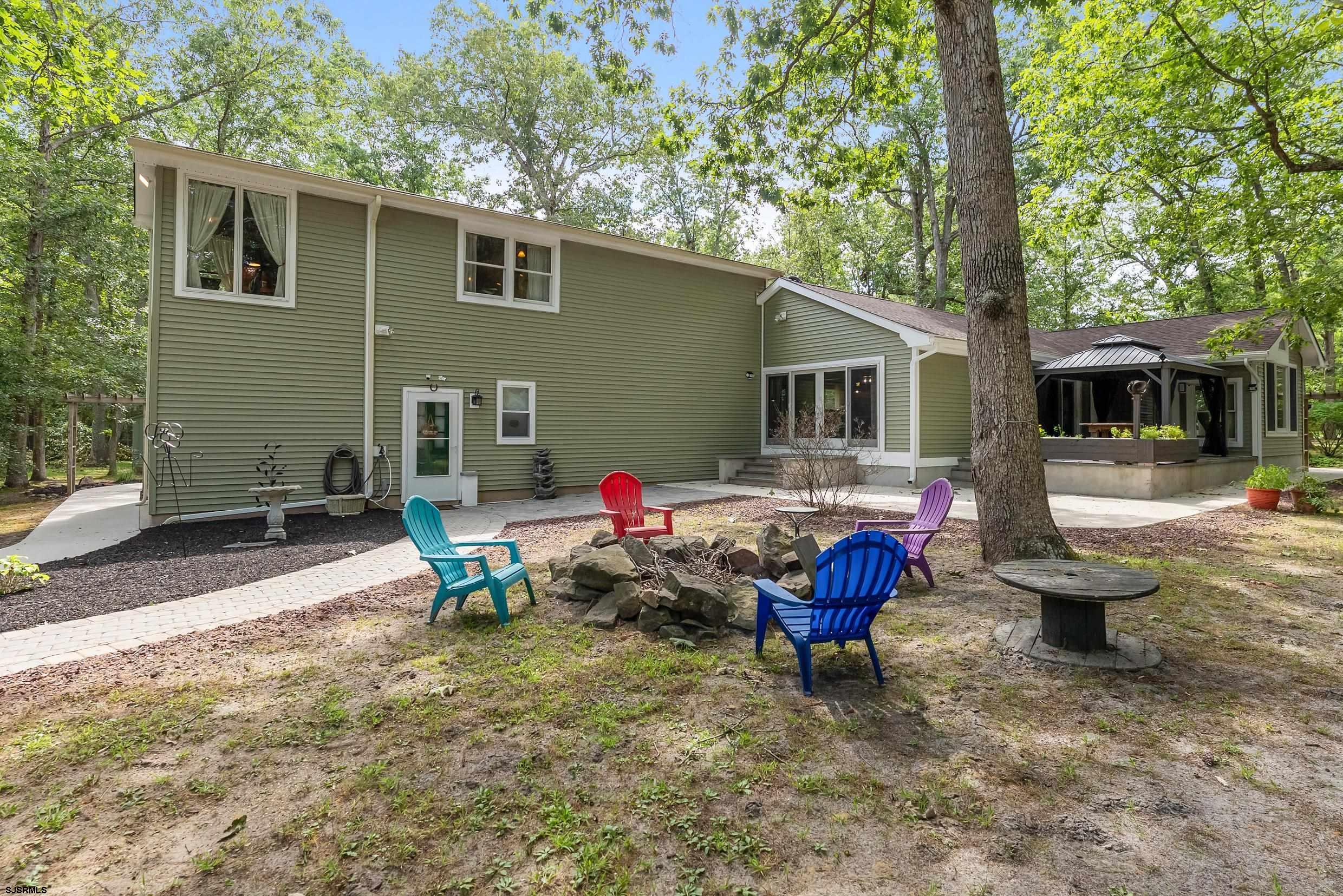2015 High Bank Road Mays Landing, NJ 08330 - Photo 59 of 89 a backyard of a house with barbeque oven table and chairs