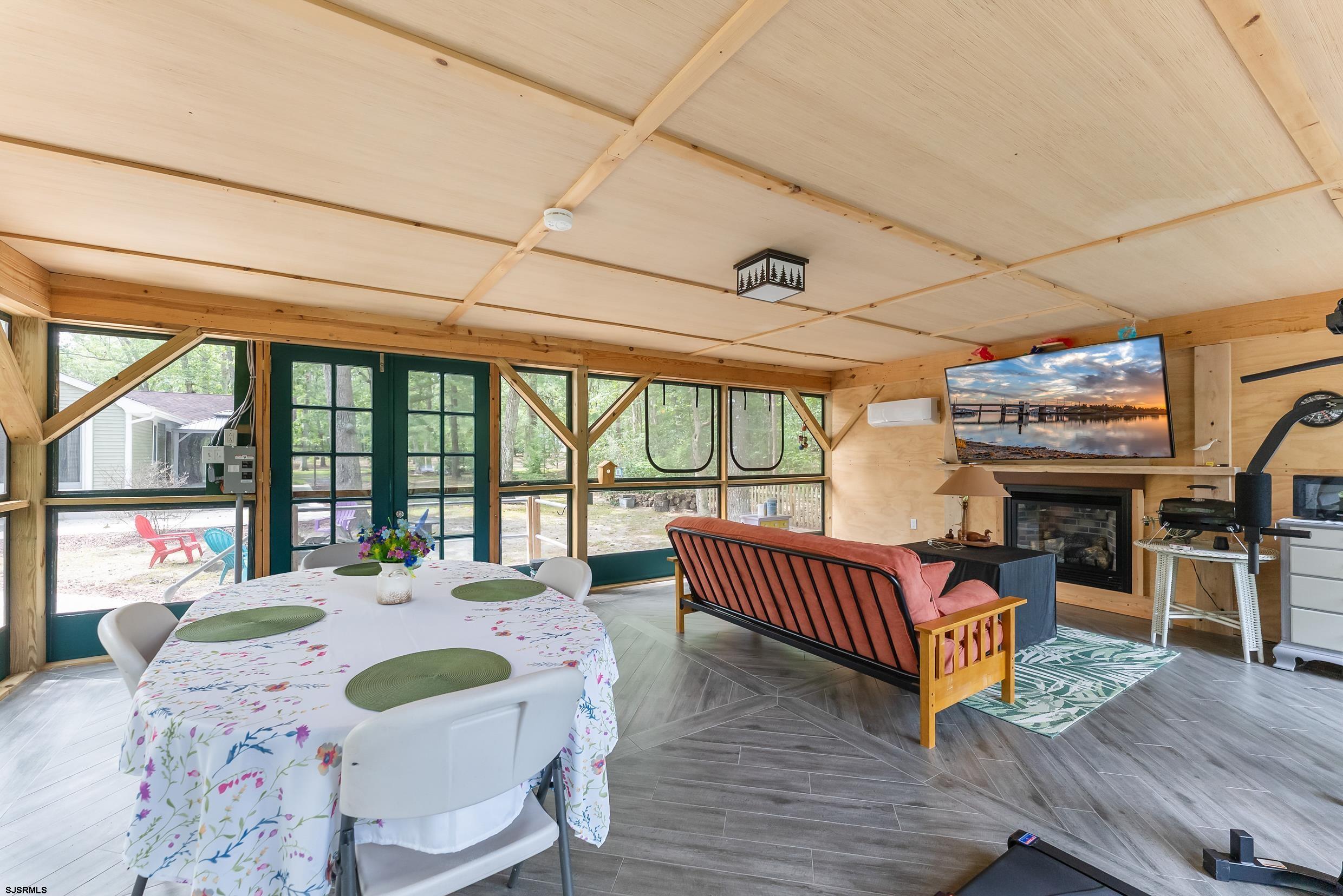 2015 High Bank Road Mays Landing, NJ 08330 - Photo 65 of 89 a view of a dining room with furniture large windows and wooden floor