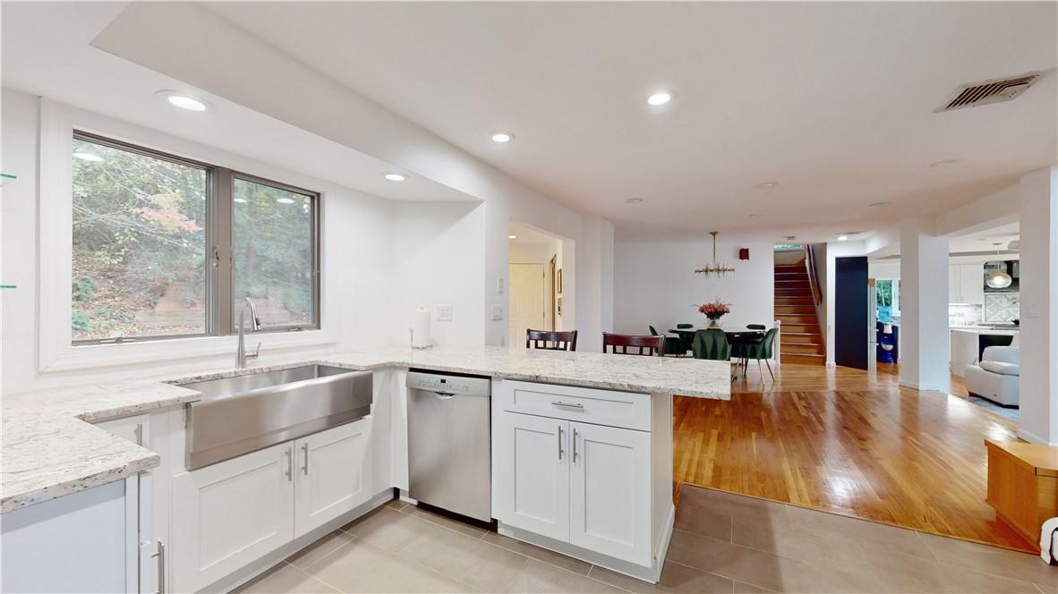 96 Old Pascack Road Pearl River, NY 10965 - Photo 12 of 36 a large white kitchen with a large window