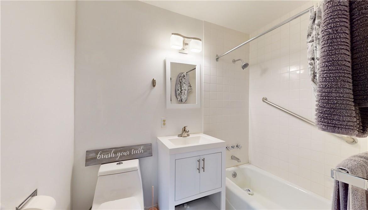 96 Old Pascack Road Pearl River, NY 10965 - Photo 14 of 36 a bathroom with a sink a mirror and a bathtub